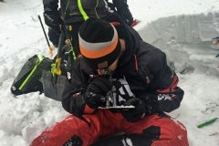 Nate Smoot, a Ride Rasmussen Style instructor studies snow crystals during an Avalanche Level 2 class instructed by Mike Duffy.