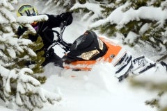 The RMSHA hillclimber student takes a G4 Summit X through some steep terrain where the trees are thick. This is do or die. The Ski-Doo G4 Summit X makes this game, easier to win.