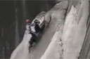 Crazy Snowmobiler Scales Reservoir Wall [video]