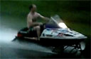 Snowmobiling Down a Flooded Street [video]