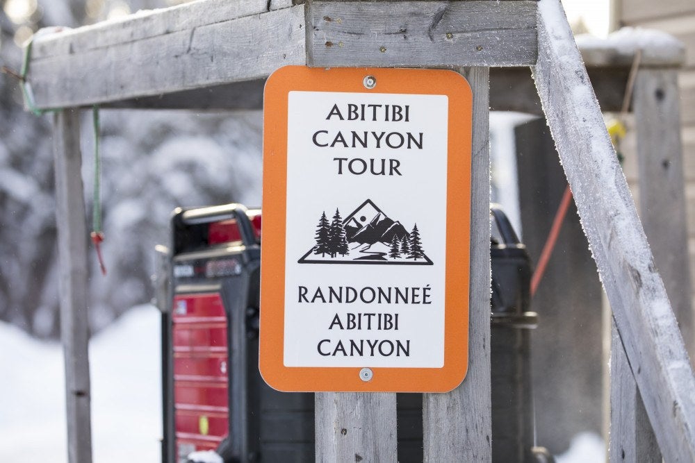 Book a tour through Abitibi Canyon for an unforgettable Ontario snowmobile trip.