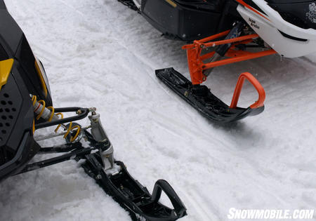 Differences in Cat’s wishbone suspension can be seen against Ski-Doo’s latest design. Note coil-over-shocks on latest REV.