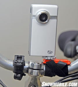 Use an 'action mount' and locate a Pure Digital Technologies Flip Video camcorder to your handlebars or helmet. (Image Courtesy Pure Digital Technologies Flip Video).
