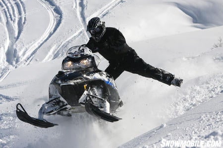 Bret Rasmussen does what it takes to keep the 700 RMK straight after coming out of a tight corner on the hillcross course.