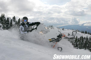 The late Rocky Cutsforth snags a few snowflakes and tosses them into the wind as he lays down a sweet line on Cat's king cat, the M1000.