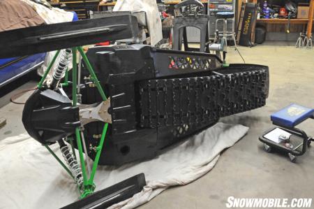 Lay out an old blanket, piece of carpet or cardboard and flip your sled on its side. Your sled will be getting moved around a lot while on its side and you don’t want it to get scuffed up on the shop floor. A moving blanket works nicely for this.