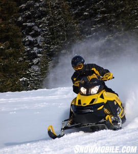 Plastic skis bite into the corner as Ski-Doo’s dual A-arm front suspension holds the grip.