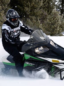 Arctic Cat’s EXT with its stretch track makes off trail travel easy for all rider levels. Snowmobile First Ride