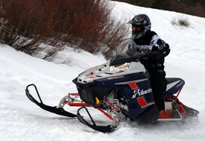 This “retro” Polaris Rush with its Pro Ride suspension and tall saddle height helped make our 100-mile day easy on our traumatized leg as we worked our way back into snowmobiling shape. Snowmobile First Ride