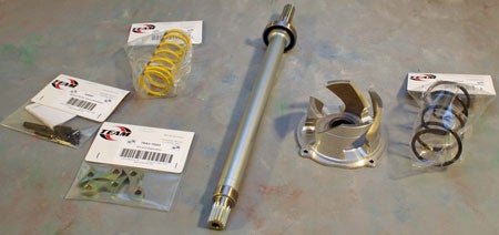 The TEAM XP Conversion kit includes from left to right the TRA primary pin kit, ramps, and spring, hollow jackshaft with bearing, Twin Trax helix, and helix spring.