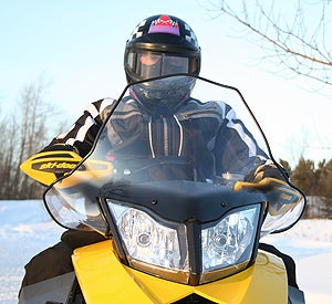 Tall Cobra windshield directs airflow off the body and hands and over the head.