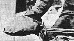 Before the advent of handlebar warmers, 1969 snowmobilers opted for handlebar mitts.
