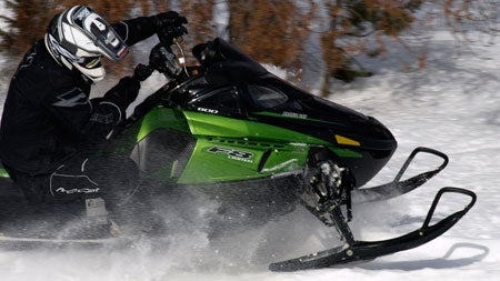 Snowmobile manufacturers like Arctic Cat offer helmets to fit your head and match your sled.