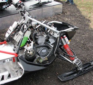 Modern sleds like this Polaris feature hydraulic brakes with lightweight brake rotors.