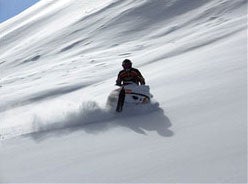 Erik Woog heads off into the Colorado Rockies near his shop.