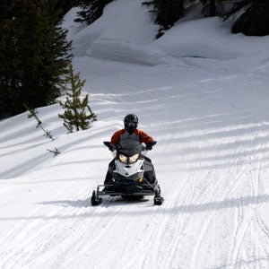 The next time you have a clean, smooth stretch of trail, say a “Thank You” to the clubs and trail groomers that maintain the heart of snowmobiling. 