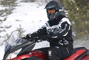 Snowmobilers wear helmets for safety as well as keeping warm.
