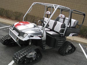 The Polaris Hot Seats Ranger is fitted with a Pure Polaris Prospector II Track System for added traction in addition to a customized, heated bench seat with individual heat controls.