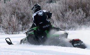 Serious snowmobilers prefer power to churn in powder.