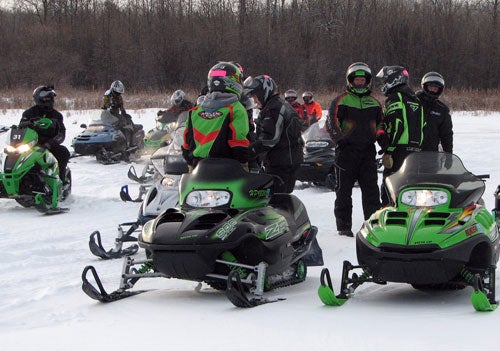 Snowmobilers Gather on a Frozen Lake