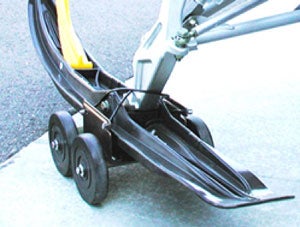 The dollies fit virtually all skis and allow you to drive your sled from trailer to shop. (Image courtesy of Recreational Necessities Sure Grip.)