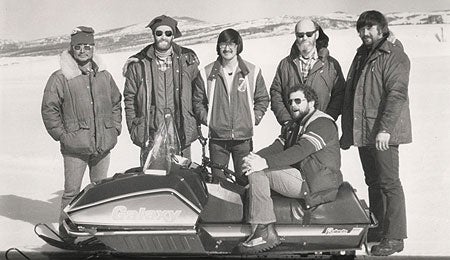 The 1979 Team Galaxy test crew consisted of (left to right): guide Sig Larsen, Polaris national service manager Bow Crosby, technician Moses Anvil, Jr., Polar Equipment marketing manager Ron Allen, Polaris cross country racing coordinator Ray Monsrud, and (seated) Snowmobile.com senior editor Jerry Bassett.