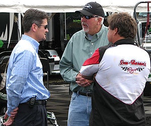 Four-time Iron Dog winner Todd Palin chats with snowmobilers.