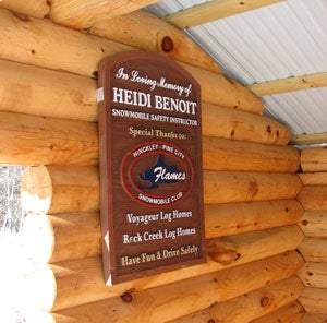 Local snowmobilers honor the memory of Heidi Benoit with the construction of a dedicated trail stop.