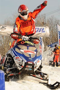 Brett Bender crosses the finish line in first. (Photo by Wayne Davis Photography)