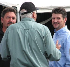 Speedwerx owner, Steve Houle (left) and Scott Eilertson (center) discuss Arctic Cat performance with Todd Palin.